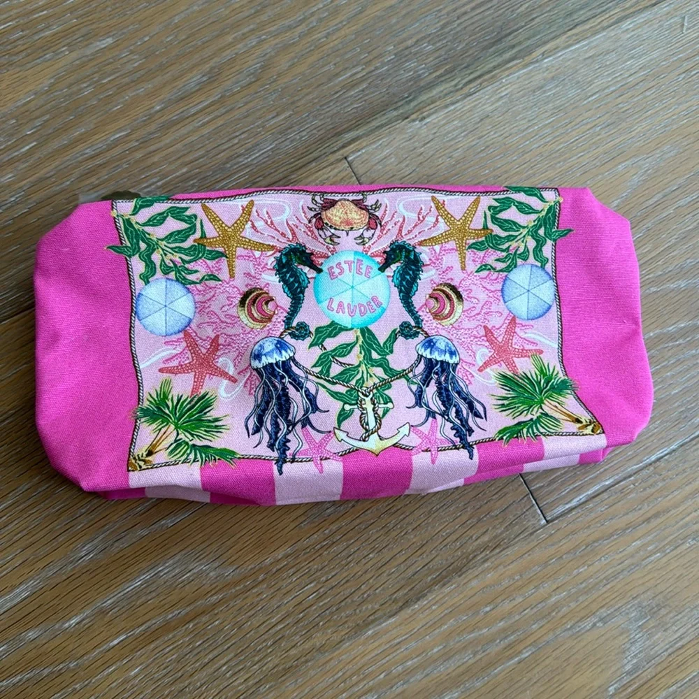 Estée Lauder pink zippered cosmetic bag with sea creatures and tropical trees